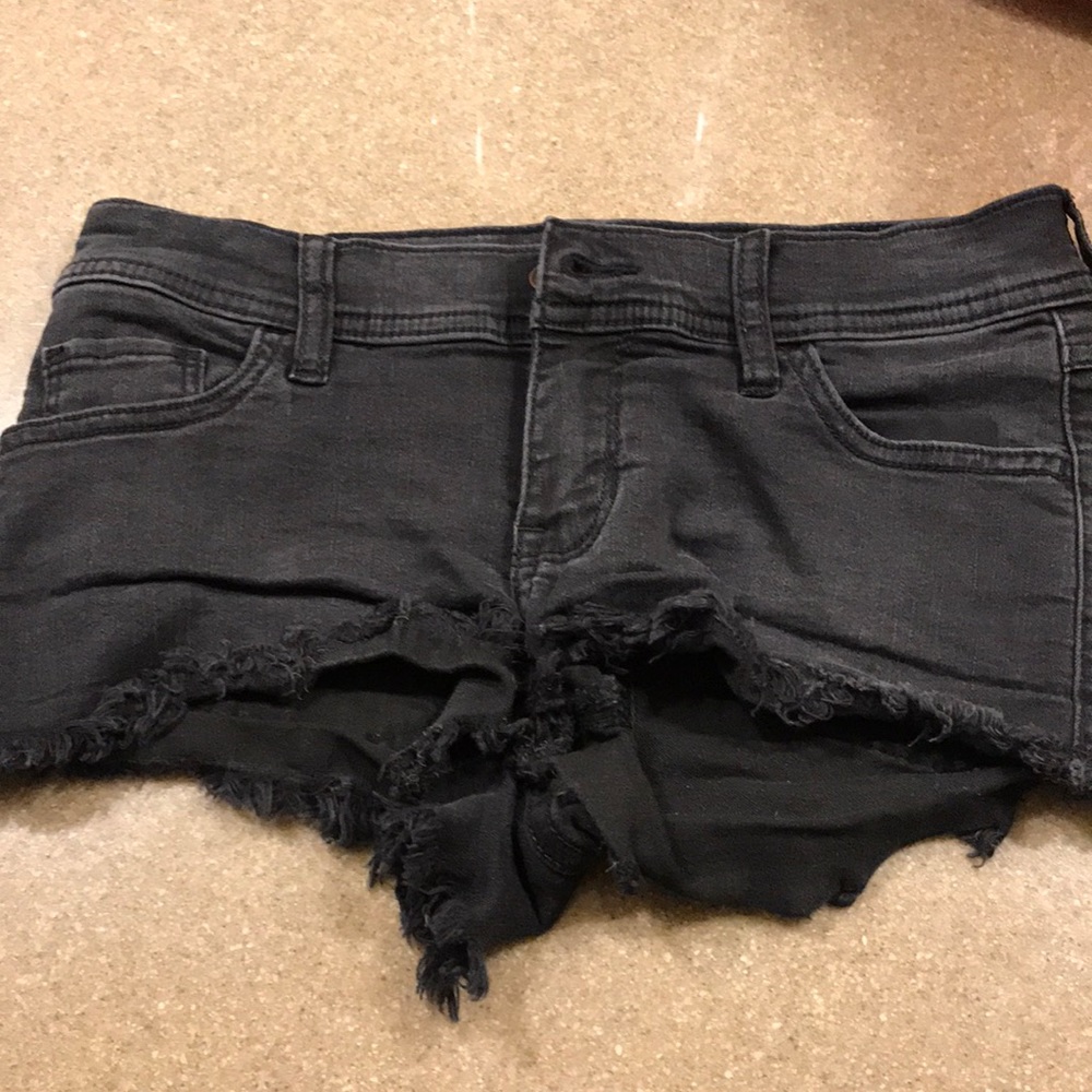 Faded black distressed short shorts